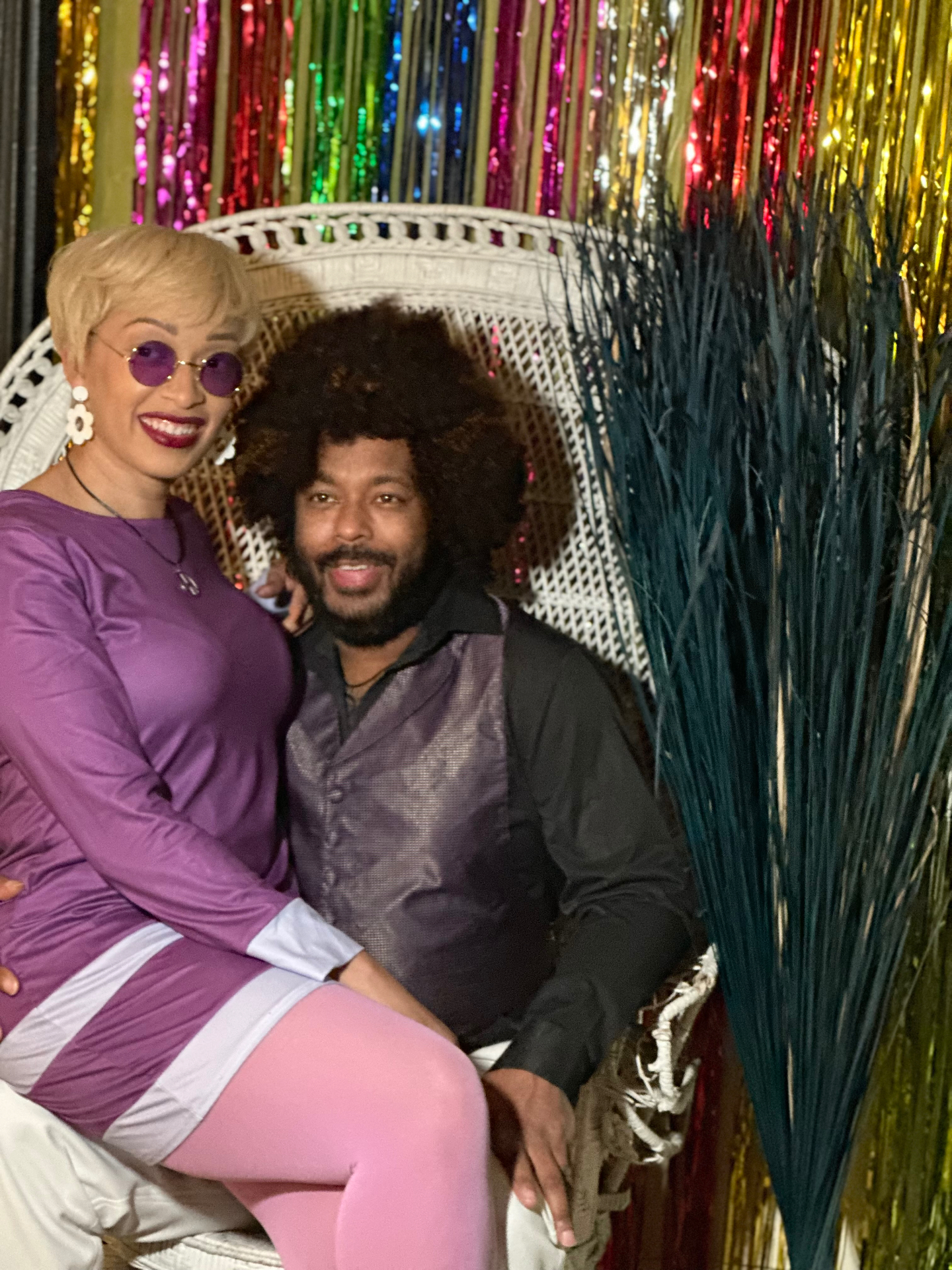 Remy and partner at a 70s themed party