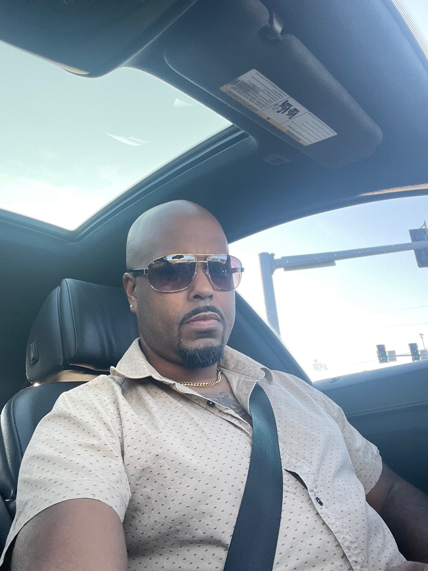 Remy in the driver seat with shades